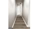 Long hallway features wood-look flooring and neutral paint at 1605 Hydrangea Ln, Mcdonough, GA 30253