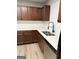 Updated kitchen featuring stainless steel appliances, white countertops, dark cabinets and subway tile backsplash at 1605 Hydrangea Ln, Mcdonough, GA 30253