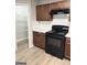Kitchen featuring stainless steel appliances, dark cabinets, solid surface countertops, and modern backsplash at 1605 Hydrangea Ln, Mcdonough, GA 30253