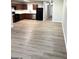 Open-concept kitchen featuring stainless steel appliances, dark cabinets and white subway tile backsplash at 1605 Hydrangea Ln, Mcdonough, GA 30253