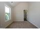 Cozy bedroom showcasing a large window and bathroom entrance at 305 Wheeler Creek Ln # 21, Mcdonough, GA 30252