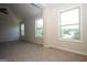 Spacious bedroom featuring large windows and modern design at 305 Wheeler Creek Ln # 21, Mcdonough, GA 30252