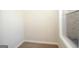Walk-in closet with carpeted floor, window and built-in shelving, providing ample storage space at 305 Wheeler Creek Ln # 21, Mcdonough, GA 30252