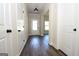 Inviting foyer with sleek, dark floors and a bright front door, seamlessly blending style and functionality at 305 Wheeler Creek Ln # 21, Mcdonough, GA 30252
