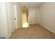 Bright hallway features neutral carpet, fresh paint, and white paneled doors at 305 Wheeler Creek Ln # 21, Mcdonough, GA 30252
