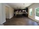 Open concept kitchen featuring dark wood cabinetry, an island, and modern recessed lighting at 305 Wheeler Creek Ln # 21, Mcdonough, GA 30252