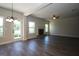 Spacious living room with a fireplace, windows, a ceiling fan, and a glass door leading to the backyard at 305 Wheeler Creek Ln # 21, Mcdonough, GA 30252