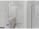 Bright bathroom features dual vanities, modern tile flooring, and a glass enclosed shower at 1597 Culpepper Ln, Mcdonough, GA 30253