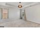 Empty carpeted bedroom with a tray ceiling, recessed lighting, and two windows at 1597 Culpepper Ln, Mcdonough, GA 30253