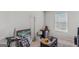 Cozy bedroom featuring a desk, mini-fridge, and other decorative elements at 1597 Culpepper Ln, Mcdonough, GA 30253