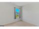 Empty bedroom with carpeted floor, neutral walls and a window with gray curtains at 1597 Culpepper Ln, Mcdonough, GA 30253