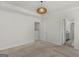 Spacious carpeted bedroom features a trey ceiling with modern lighting fixture and neutral paint at 1597 Culpepper Ln, Mcdonough, GA 30253