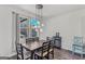 Dining room featuring a wooden table with seating for six and elegant pendant lighting at 1597 Culpepper Ln, Mcdonough, GA 30253
