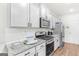 Well-equipped kitchen with stainless steel appliances, granite countertops, and ample cabinet space at 1597 Culpepper Ln, Mcdonough, GA 30253