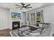 Comfortable living room with a fireplace, large sectional, and views of the backyard at 1597 Culpepper Ln, Mcdonough, GA 30253