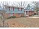 Split-level home with a mix of brick and siding, offering a glimpse of its classic design at 77 Crystal River Dr, Riverdale, GA 30274