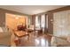 Inviting living room with hardwood floors, neutral walls, and elegant furniture, perfect for gatherings at 77 Crystal River Dr, Riverdale, GA 30274