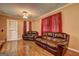 Cozy living room showcasing comfortable leather seating, warm lighting, and a relaxed ambiance at 77 Crystal River Dr, Riverdale, GA 30274