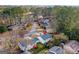 Aerial view of a single Gathering home in a quiet neighborhood with mature trees and well-maintained lawns at 111 Hamilton Rd, Peachtree City, GA 30269
