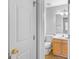 Cozy bathroom features a single sink vanity, toilet, and neutral wall paint at 111 Hamilton Rd, Peachtree City, GA 30269