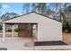 Spacious detached carport with lattice design and storage shed on a well-maintained lot at 111 Hamilton Rd, Peachtree City, GA 30269