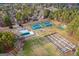 Aerial view showcases community amenities including tennis courts, a playground, and a community garden at 111 Hamilton Rd, Peachtree City, GA 30269