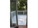 White painted wooden deck through open glass doors offers seamless transition to the outside at 111 Hamilton Rd, Peachtree City, GA 30269