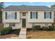 Charming two-story home with green shutters, a welcoming front door, and landscaped front yard at 111 Hamilton Rd, Peachtree City, GA 30269