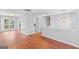Bright living room boasts hardwood floors and flows seamlessly into the adjacent rooms at 111 Hamilton Rd, Peachtree City, GA 30269
