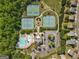 Aerial view of community amenities with tennis courts, a basketball court, a pool, and a community center at 5260 Sherwood Way, Cumming, GA 30040