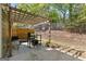 Backyard patio offers a pergola, comfortable seating, and plenty of space for outdoor dining and relaxation at 5260 Sherwood Way, Cumming, GA 30040