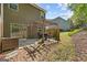 A backyard patio with a pergola, outdoor furniture, and views of the surrounding yard at 5260 Sherwood Way, Cumming, GA 30040