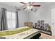 Bedroom with a ceiling fan, a window letting in light, and wall decor that brings the room to life at 5260 Sherwood Way, Cumming, GA 30040