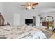 Bright bedroom with a ceiling fan, TV, dresser, and a cozy bed featuring a Parisian-themed comforter at 5260 Sherwood Way, Cumming, GA 30040