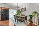 Elegant dining room featuring a stylish light fixture, comfortable seating, and backyard access at 5260 Sherwood Way, Cumming, GA 30040