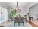 Bright dining space featuring elegant décor, modern lighting, and seamlessly integrated with adjacent living areas at 5260 Sherwood Way, Cumming, GA 30040