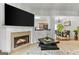 Bright living room showcases a fireplace and flows into the dining area, perfect for entertaining and relaxing at 5260 Sherwood Way, Cumming, GA 30040