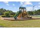 Community playground featuring a slide and climbing structure, designed for fun and safe outdoor play at 5260 Sherwood Way, Cumming, GA 30040