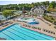 Community clubhouse features a large pool, a splash pad, and plenty of lounge chairs at 5260 Sherwood Way, Cumming, GA 30040