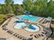 Gathering-friendly pool area with splash pad, waterslide, and plenty of lounge seating for a fun and relaxing day at 5260 Sherwood Way, Cumming, GA 30040