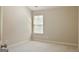 Carpeted bedroom with window offering natural light, ideal for relaxation and rest at 2638 Lake Manor Cir, Duluth, GA 30096