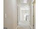Upstairs hallway with neutral carpeting and paint provides access to multiple rooms at 2638 Lake Manor Cir, Duluth, GA 30096