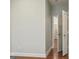 Hallway features hardwood floors and neutral paint, leading to other rooms in the house at 2638 Lake Manor Cir, Duluth, GA 30096