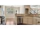 Modern kitchen with granite countertops, stainless steel appliances, and dark wood floors at 2638 Lake Manor Cir, Duluth, GA 30096