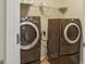 Laundry room featuring modern washer and dryer units for convenient chores at 2638 Lake Manor Cir, Duluth, GA 30096