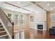Bright living room with wood floors, coffered ceilings, gas fireplace and large windows at 2638 Lake Manor Cir, Duluth, GA 30096
