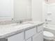 Modern bathroom with granite vanity, white cabinetry, and a tub-shower combo at 289 Limestone Circle, Conyers, GA 30013