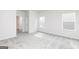 Bright bedroom with carpeted floors, lots of light, and two windows at 289 Limestone Circle, Conyers, GA 30013