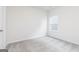 Cozy bedroom featuring neutral walls, light-gray carpet, and a window at 289 Limestone Circle, Conyers, GA 30013