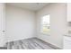 Dining area with large window and wood-style flooring at 289 Limestone Circle, Conyers, GA 30013